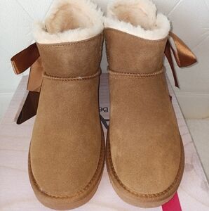 BearPaw Cozy Tan Suede Boots with Ribbon Detail.